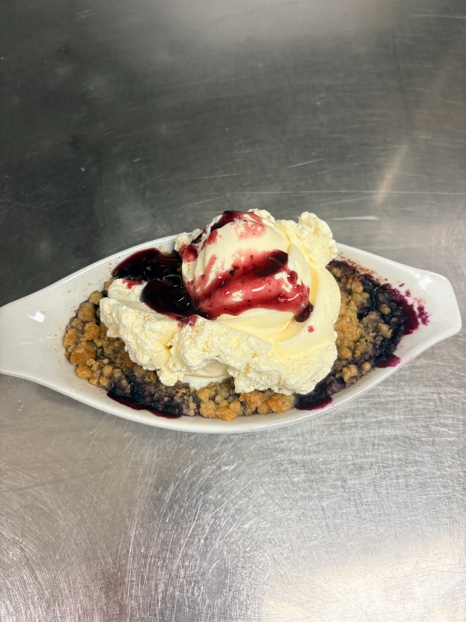 Waffles and blueberries: lightly toasted Belgian waffles topped with fresh blueberries and whipped cream, with a choice of bacon, sausage or ham at Blue Canoe at the Lincoln Big Stop